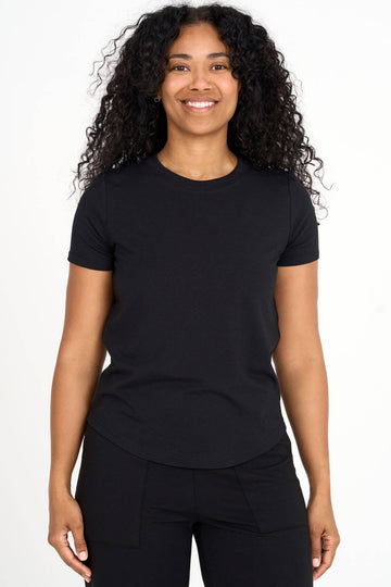 Woman wearing black Tencel blend classic round neck t-shirt, made by Canadian loungewear label Advika.