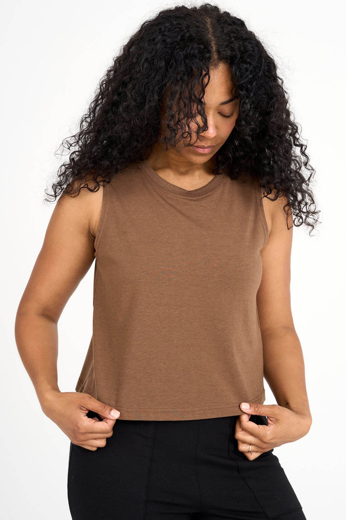 Woman wearing woodsmoke brown tencel cropped tank top by Canadian loungewear label Advika. 