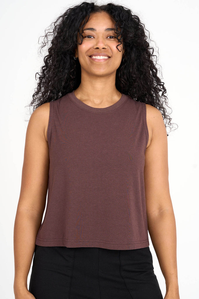 Woman wearing coffee brown tencel cropped tank top by Canadian loungewear label Advika. 