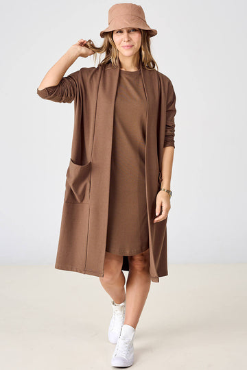 Woman wearing tencel brown open front long sleeve cardigan over t-shirt dress and matching bucket hat by Advika. 
