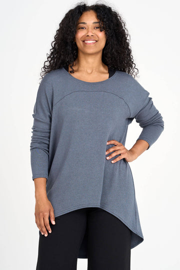 Woman wearing shadow grey Tencel long sleeve slouchy top with back pleat detail, made by Canadian loungewear label Advika. 