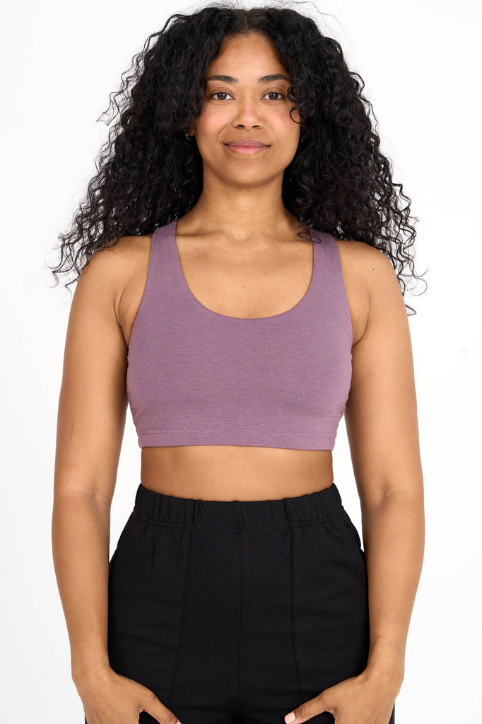 Woman wearing mauve Tencel blend sports bra, made by Canadian loungewear label Advika.