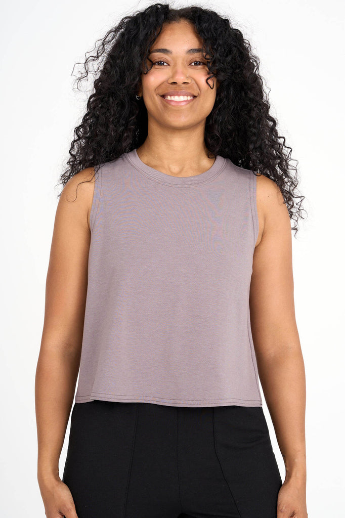 Woman wearing mink grey tencel cropped tank top by Canadian loungewear label Advika. 