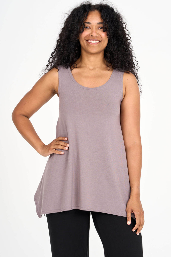 Woman wearing mink grey Tencel flared tank top, made by Canadian loungewear label Advika. 