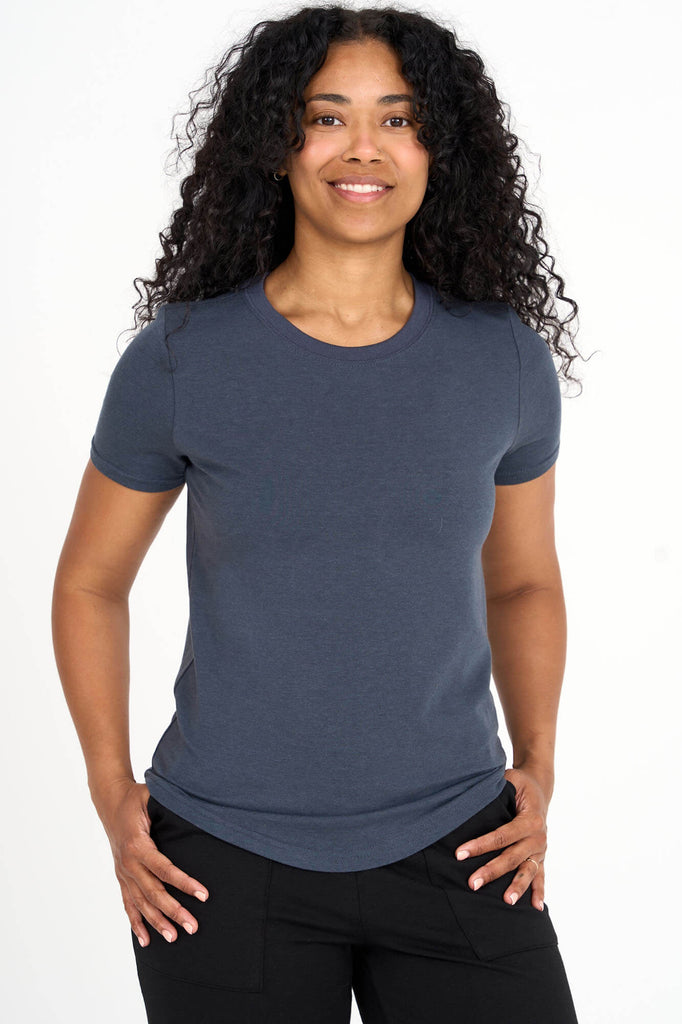 Woman wearing steel blue Tencel blend classic round neck t-shirt, made by Canadian loungewear label Advika.