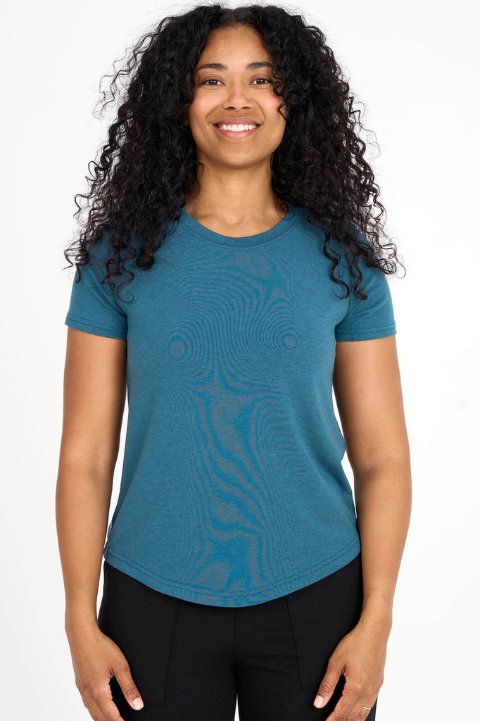 Woman wearing dusty teal Tencel blend classic round neck t-shirt, made by Canadian loungewear label Advika.