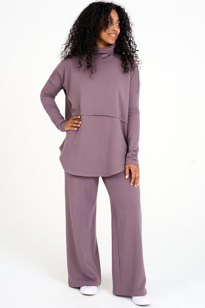 Woman wearing ube purple Abigail top with matching  tencel wide leg loungewear palazzo pants by Advika. 