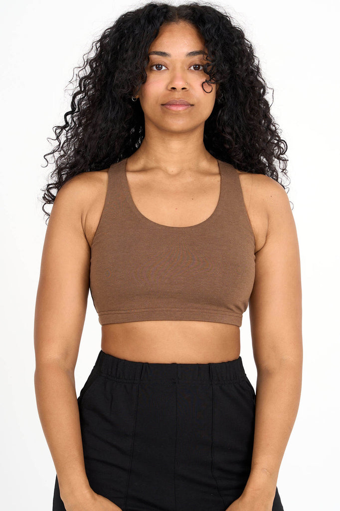 Woman wearing woodsmoke brown Tencel blend sports bra, made by Canadian loungewear label Advika.