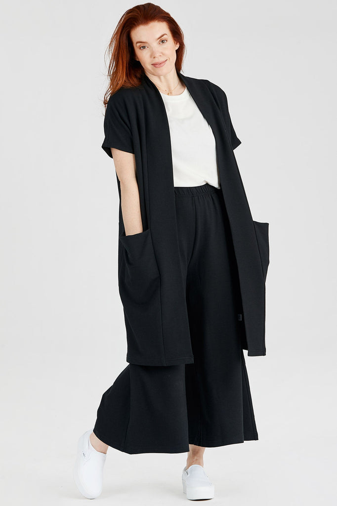 Woman wearing Tencel duster cardigan in black, Canadian made loungewear