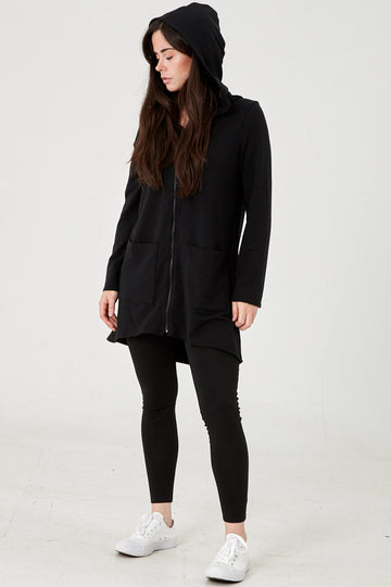Woman wearing Tencel hoodie in black, Canadian made women's loungewear, front