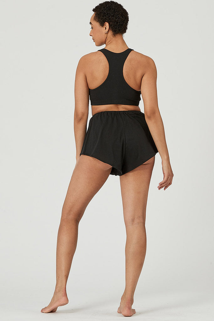 Woman wearing Tencel lounge shorts in black, Canadian made women's loungewear, back