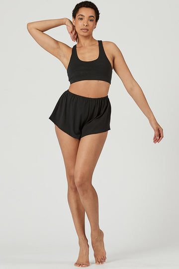 Woman wearing Tencel lounge shorts in black, Canadian made women's loungewear, front