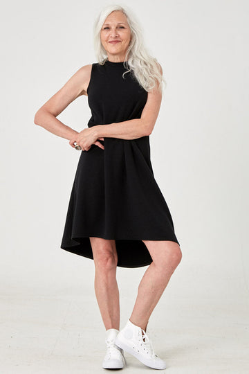 Woman wearing Tencel mock neck sleeveless dress in black, Canadian made women's loungewear, front