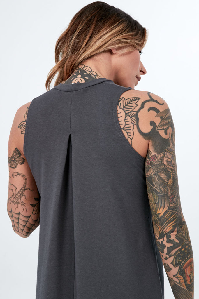 Woman wearing Tencel mock neck sleeveless dress, Canadian made women's loungewear, back close