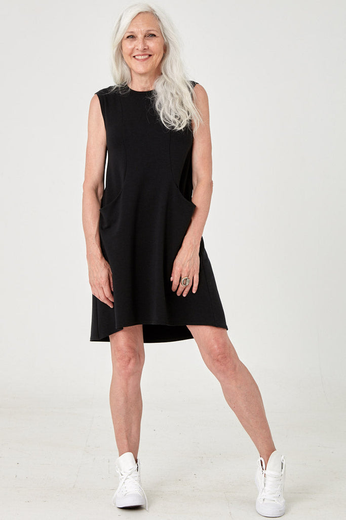 Woman wearing Tencel sleeveless tunic with pockets in black, Canadian made loungewear, front