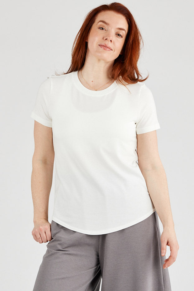 Woman wearing basic Tencel t-shirt in ivory, Canadian made women's loungewear, front