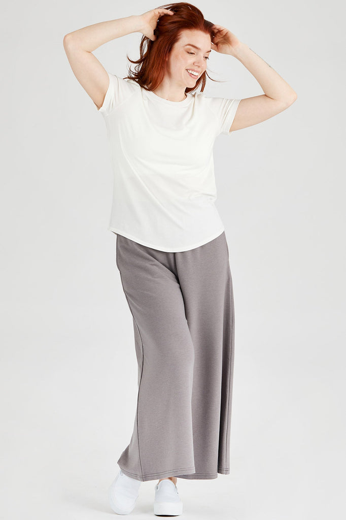 Woman wearing basic Tencel t-shirt in ivory, Canadian made women's loungewear
