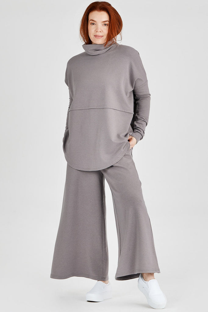 Woman wearing Tencel oversized turtleneck in grey, Canadian made women's loungewear, front
