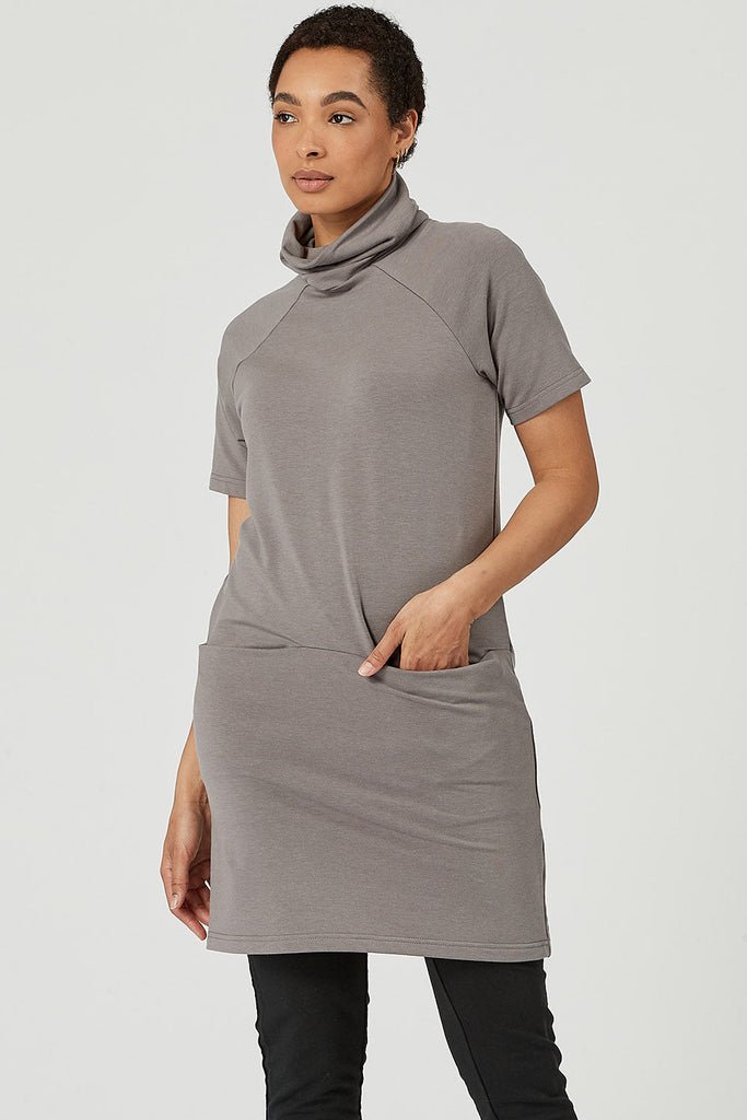 Woman wearing tencel turtleneck tunic with pockets in grey, Canadian made women's loungewear, standing