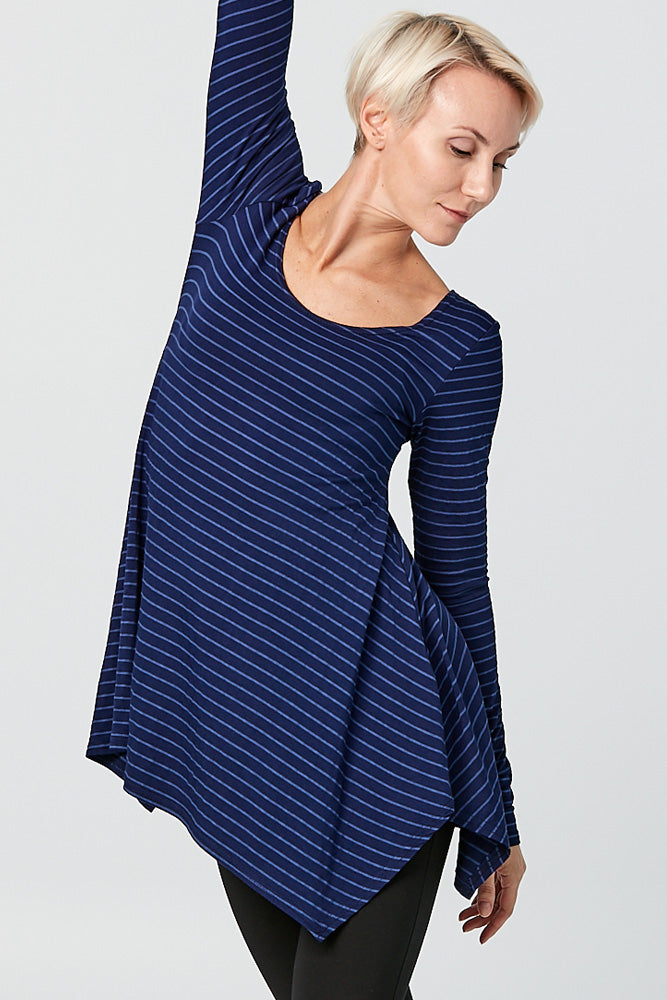 Woman wearing Tencel stripe long sleeve top in blue, front close